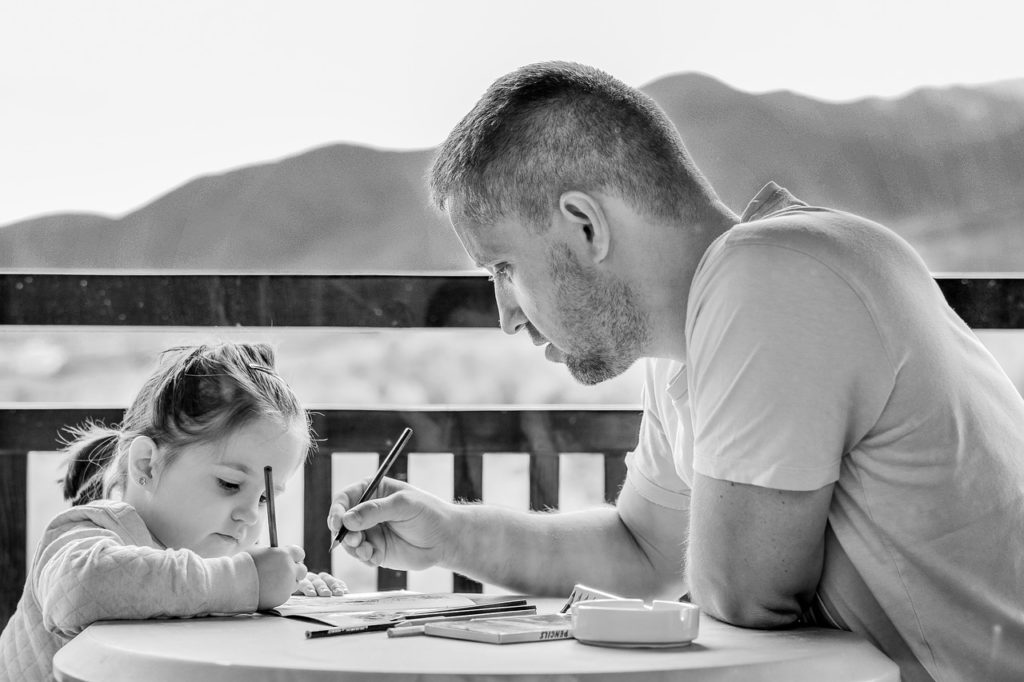 Father helping child to study ( parenting tips for toddlers )